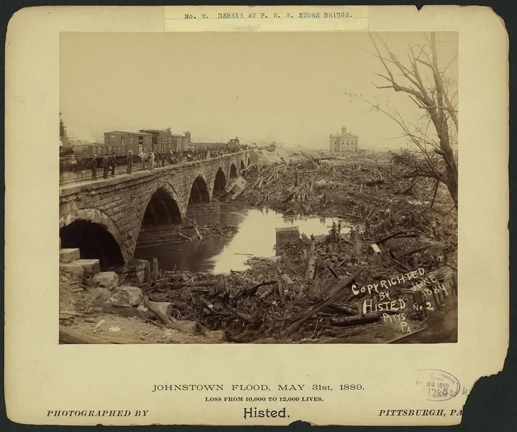 Debris piled against the Stone Bridge in Johnstown after the 1889 flood